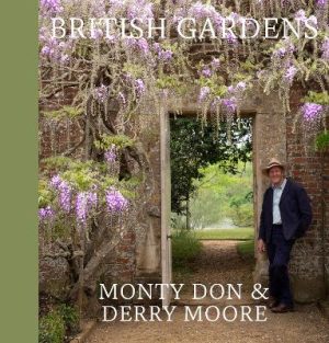 Cover of British Gardens, Monty Don stands by a doorway through a brick wall, surrounded by wisteria in flower