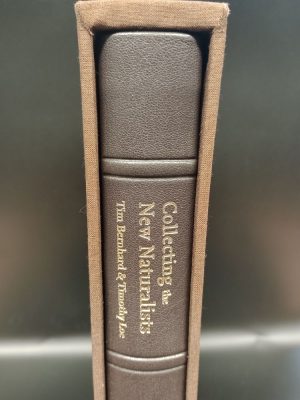 Top portion of the spine of the leather bound version of Collecting the New Naturalists, in it's brown cloth slipcase, showing the title and authors in gilt